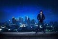 Bad guy standing on the building rooftop Royalty Free Stock Photo