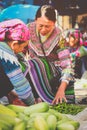 Hmong women selling vetgetable in Bac Ha market, Northern Vietnam Royalty Free Stock Photo