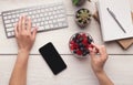 Woman eating candies at workplace, top view Royalty Free Stock Photo