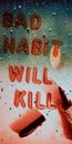 bad habit will kill question displayed on inverted abstract background with water drops Royalty Free Stock Photo