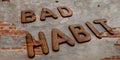 bad habit words written on brick wall textures background Royalty Free Stock Photo