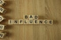 Bad influence text from wooden blocks