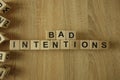 Bad intentions text from wooden blocks Royalty Free Stock Photo