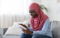 Bad Message. Annoyed Black Muslim Woman In Hijab Shouting On Cellphone At Home
