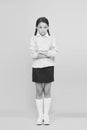 In bad mood. unhappy girl in school uniform. education concept. back to school. smart little girl on yellow background