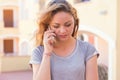 Bad news. Sad woman on phone. beautiful upset unhappy, serious girl talking on mobile Royalty Free Stock Photo