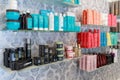 Professional cosmetic and care products for men and women standing on shelf in hair beauty salon for home using