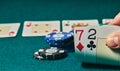 Bad poker gamble or unlucky hand concept with player going all in with 2 and 7 two and seven offsuit also called unsuited, Royalty Free Stock Photo