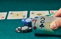 Bad poker gamble or unlucky hand concept with player going all in with 2 and 7 two and seven offsuit also called unsuited, Royalty Free Stock Photo