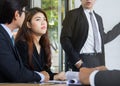 Bored business woman sitting in the meeting conference tired with very long presentation Royalty Free Stock Photo