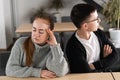 Bad relationship concept. Man and woman in disagreement. Young couple after quarrel sitting next to each other. Outdoor Royalty Free Stock Photo