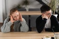 Bad relationship concept. Man and woman in disagreement. Young couple after quarrel sitting next to each other. Outdoor Royalty Free Stock Photo