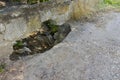 Bad road, potholes after the flood in the asphalt on the bridge