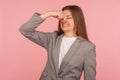 Bad smell! Portrait of young woman in business suit pinching nose and frowning in displeasure, expressing repulsion Royalty Free Stock Photo