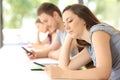 Bad students distracted using phones during a class Royalty Free Stock Photo