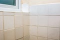 Bad tiling. Terrible bathroom tile DIY fixing and grouting job Royalty Free Stock Photo