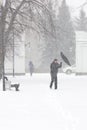 Bad weather in a city: a heavy snowfall and blizzard in winter, vertical