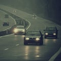 Bad weather driving - foggy hazy country road. Motorway - road traffic. Winter time