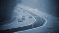 Bad weather driving - foggy hazy country road. Motorway - road traffic. Winter time Royalty Free Stock Photo