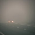 Bad weather driving - foggy hazy country road. Motorway - road traffic. Winter time Royalty Free Stock Photo