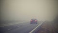 Bad weather driving - foggy hazy country road. Motorway - road traffic. Winter time