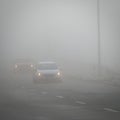 Bad weather driving - foggy hazy country road. Motorway - road traffic. Winter time Royalty Free Stock Photo