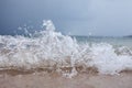 bad weather, a storm begins on the sea, dark blue clouds hang in the sky,coastline, wave, splash Royalty Free Stock Photo