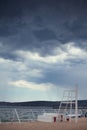 bad weather, a storm begins on the sea, dark blue clouds hang in the sky,coastline, wave, splash Royalty Free Stock Photo