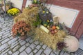 Bad Windsheim, Germany - 16 October 2019: View on the stone floor and autumn decoration with flowers, pumpkins and fruits Royalty Free Stock Photo