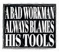 A BAD WORKMAN ALWAYS BLAMES HIS TOOLS, text on black stamp sign