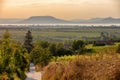 The Badacsony mountain from far with Lake Balaton at sunset