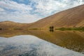 Badain Jaran Desert with lake and reflection Royalty Free Stock Photo