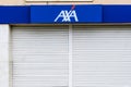 Badalona, Barcelona, Spain - April 24, 2021. Logo and facade AXA, French multinational specialized in the insurance business