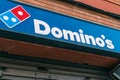 Badalona, Barcelona, Spain - February 25, 2021. Domino`s Pizza is an American fast food restaurant company, specialized in making