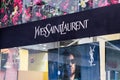 Badalona, Barcelona, Spain - March 10, 2021. Logo and facade ofYves Saint Laurent or YSL, fashion house founded by Yves Saint