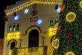 Badalona, Spain November 25, 2023. Festive architecture with illuminated Christmas tree and decoration. Badalona, Spain