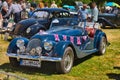 BADEN BADEN, GERMANY - JULY 2022: blue Morgan Plus 8 1968 cabrio roadster, oldtimer meeting in Kurpark