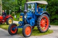 BADEN BADEN, GERMANY - JULY 2019: blue red LANZ BULLDOG retro tractor 1921 1960, oldtimer meeting in Kurpark