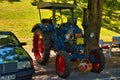 BADEN BADEN, GERMANY - JULY 2022: blue red LANZ BULLDOG retro tractor 1921 1960, oldtimer meeting in Kurpark