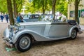 BADEN BADEN, GERMANY - JULY 2019: white poodle in silver gray BE