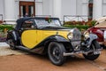 BADEN BADEN, GERMANY - JULY 2019: yellow black BUGATTI TYPE 57 cabrio roadster 1934, oldtimer meeting in Kurpark