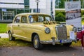 BADEN BADEN, GERMANY - JULY 2019: yellow MERCEDES-BENZ PONTON W180 220S sedan 1954 1959, oldtimer meeting in Kurpark