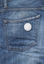 Badge on a blue denim pocket background Royalty Free Stock Photo