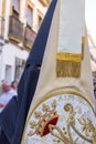 Badge of the Brotherhood and fellowship carried by a penitent in the Holy Week procession. The text A Los Cielos