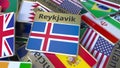 Souvenir magnet or badge with Reykjavik text and national flag among different ones. Traveling to Iceland conceptual 3D