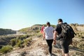 People hiking amidst the landscapes in Alberta`s Dinosaur Provincial Park