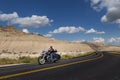 Bikers riding their chopper motorcycles on a dirt road at the Badlands National Park