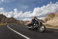 Bikers riding their chopper motorcycles on a road at the Badlands National Park