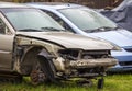 Badly damaged rusted car after road accident