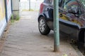 Badly parked car with tire on pavement shows wheel on walkway as traffic violation with penalty for poor driving and parking viola Royalty Free Stock Photo